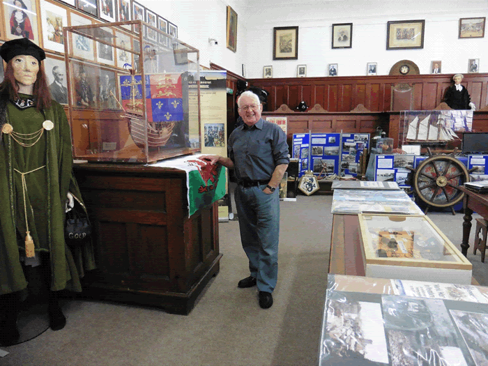 David James with his model of Henry VIIs ship Mary Fortune in Pembroke Museum