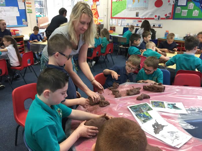 Artist Joanna Burton with pupils of Golden Grove School